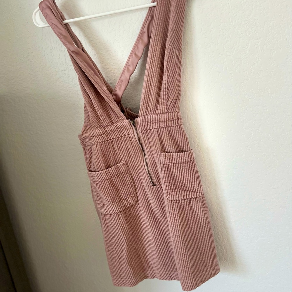 A dress/romper chic modern, dusted pink